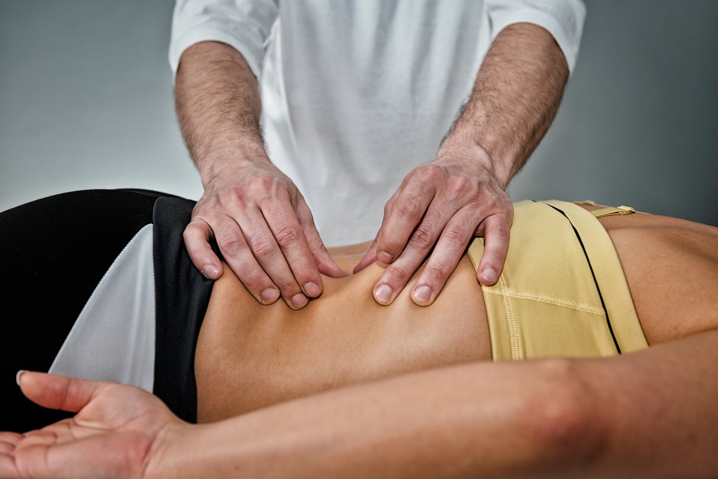 Osteopath working with patient